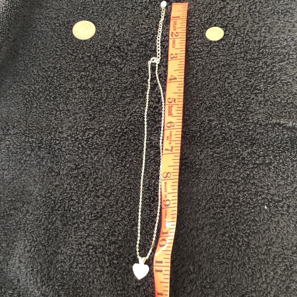 Heart bling dime size w/solid back with slight rub marks on back. Silver color. - Picture 10 of 15